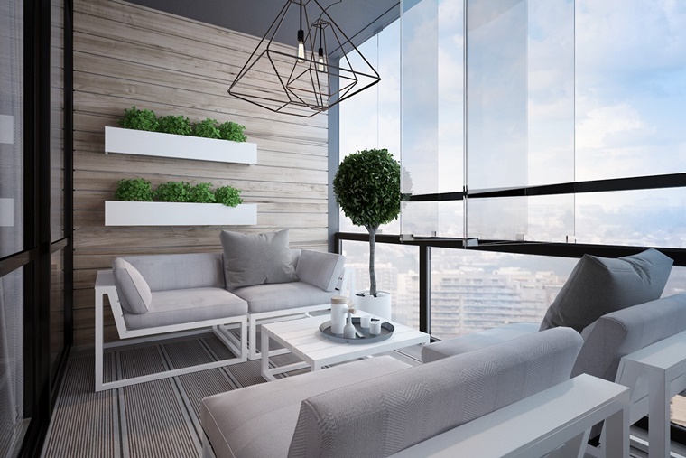 arredo terrazzo moderno divanetti bianchi piante muro