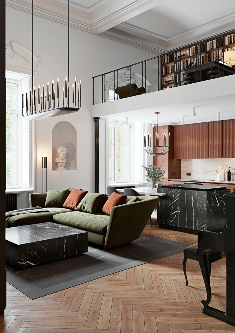 Salotto moderno, divano di colore verde, cucina con isola centrale in marmo