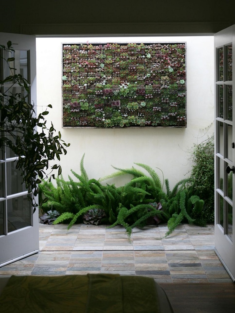 idea originale recinzione cemento decorata piante grasse