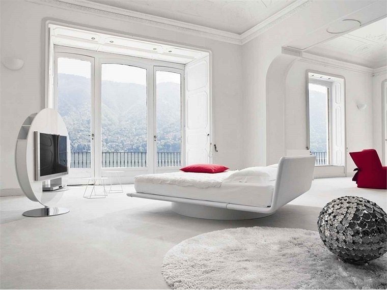 camera da letto arredata mobili colore bianco tv 