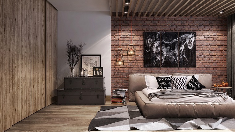 idee-arredamento-zona-notte-parete-mattoni-vista-quadro-cavallo-letto-design-illuminazione-lampade-sospensione