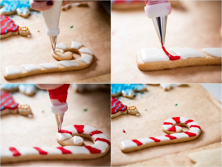 Dolci natalizi, come decorare con la glassa reale un biscotto con la forma a bastoncino natalizio 