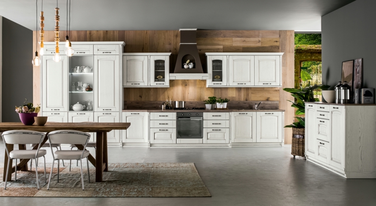 arredamento per cucine in muratura moderne bianche con tavolo e pannello alla parete in legno
