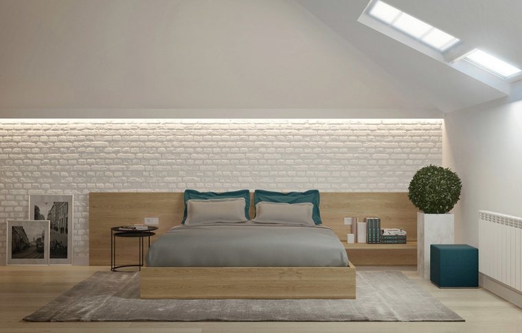 camera da letto in mansarde moderne, con parete con mattoni bianchi a vista e struttura letto in legno chiaro