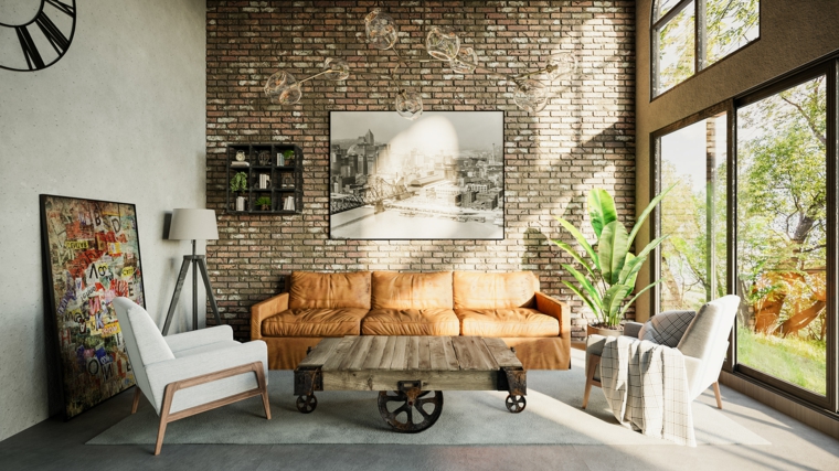 salotto rustico con divano in pelle parete in pietra con decorazione quadro
