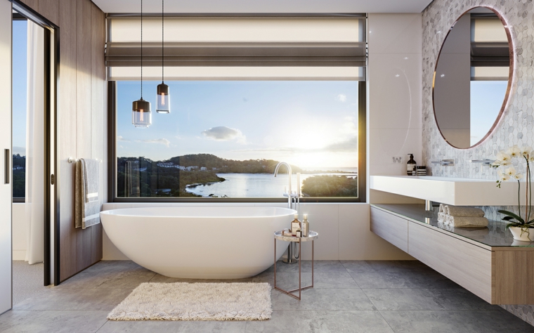 Rivestimento bagno moderno con piastrelle di colore grigio, vasca forma ovale e tavolino con accessori