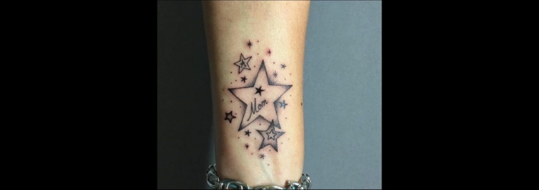Idea per dei tatuaggi con scritte sulla mano di una donna, disegno stella grande