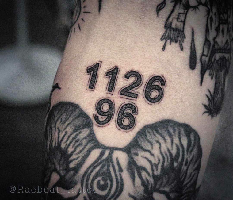 Catalogo tatuaggi, tattoo con numeri, disegno animale sul braccio