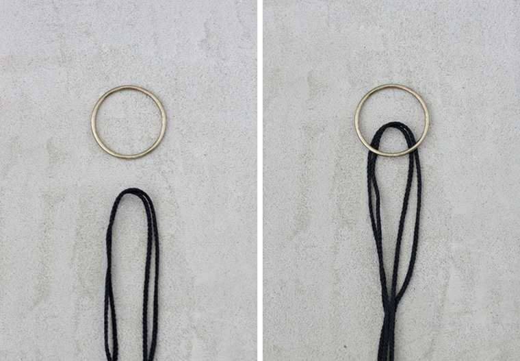 Mensole portalibri, corda di colore nero con un anello di metallo su sfondo grigio