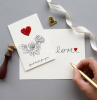cosa regalare a san valentino cartolina fatta a mano con disegno cuore e scritta love