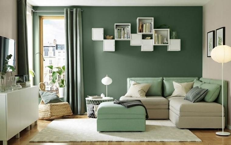tonalità di verde per pareti interne salotto con divano angolare arredamento con credenza bianca