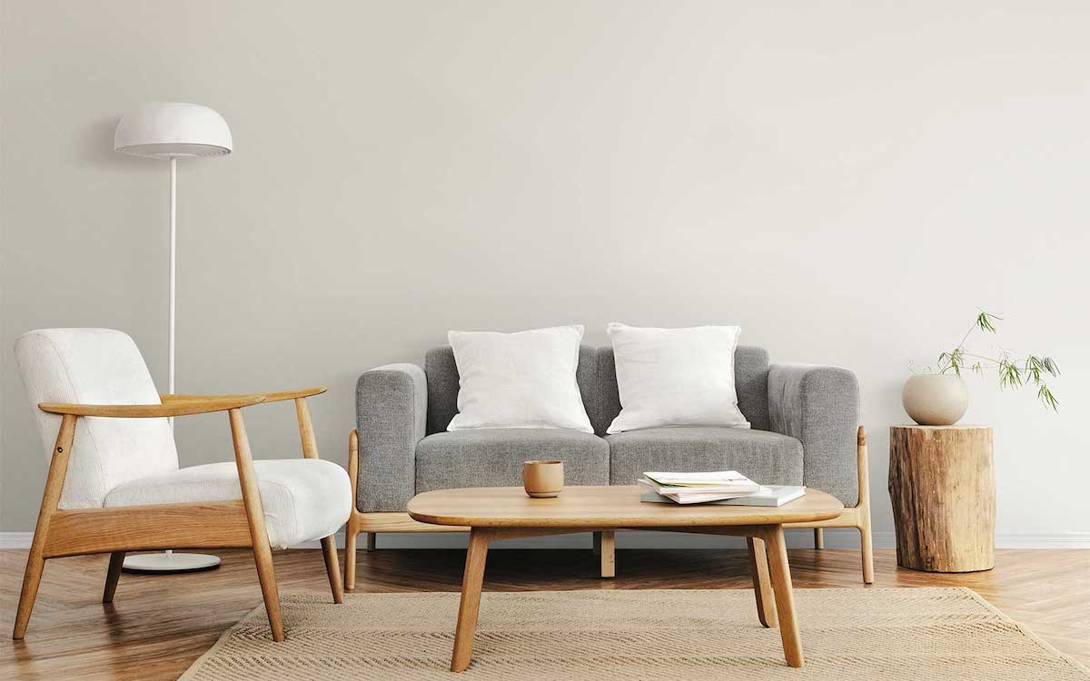 arredamento soggiorno classico divano grigio tavolino ovale di legno