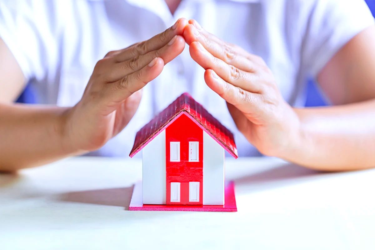 protect your house. the concept of protection and property insurance.